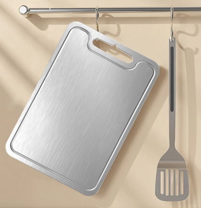 planche à découper inox accroché